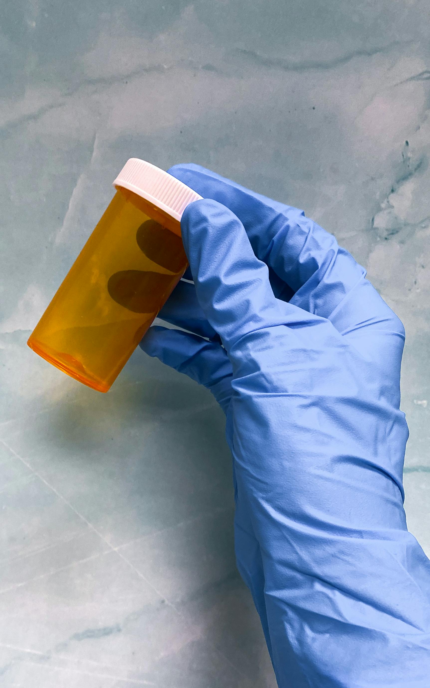 Person scanning prescription bottle with smartphone